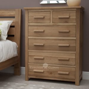 Bury Solid Oak 6 drawer chest. two drawers at the top and 4 long drawer underneath. light lacquered oak finish with choice of metal or wood bar handles