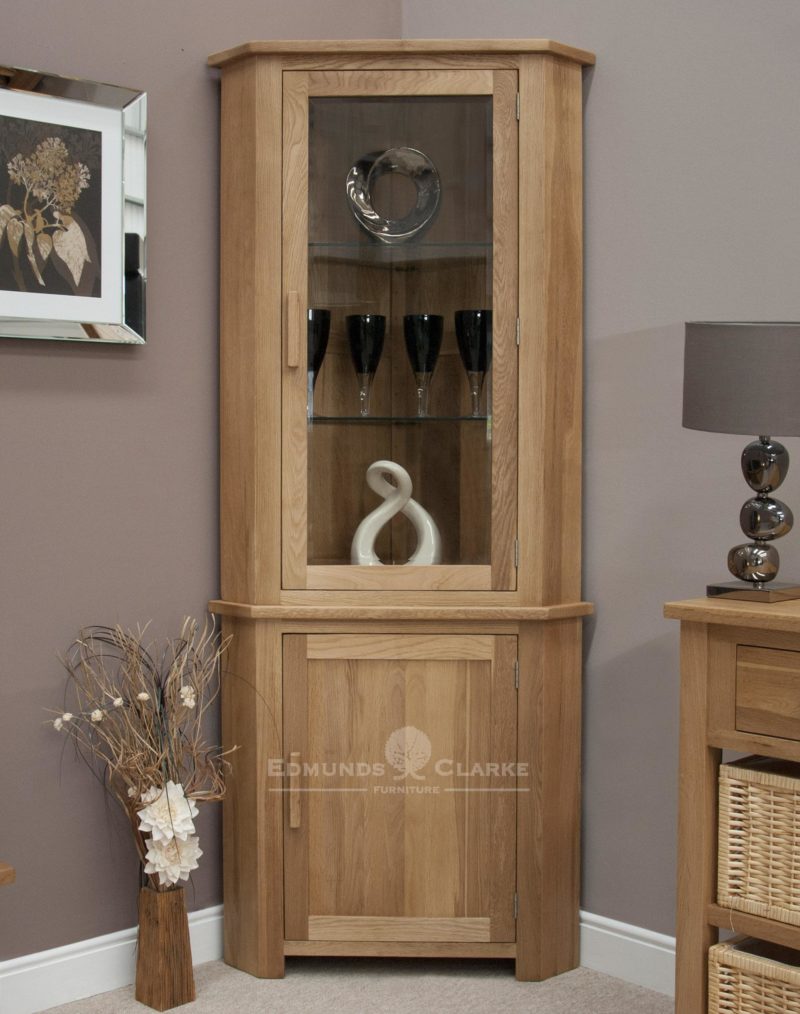 Bury Solid Oak Corner Display Unit. Adjustable glass shelves and cupboard underneath, chrome handles or oak bar handles available as optional extra