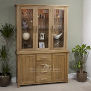 Bury Large Oak Dresser. chrome handles as stndard, oak bar handles available as optional extra. 4 centre drawers & cupboards with glass bevelled doors above and adjustable glass shelves