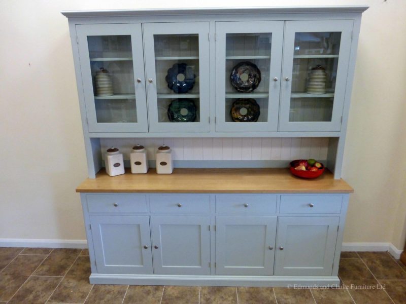 Painted 7ft Half Glazed Dresser. Handmade with solid oak top on the sideboards, painted shelves, 4 drawers with 4 large cupboards below. 4 door glazed rack above painted in southwold sky blue and satin nickel knobs. contrasting white backboards on racking EDM021