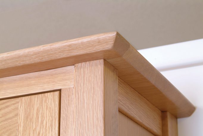 Image showing moulded top detail on a piece of Norwich Oak by Edmunds & Clarke Furniture