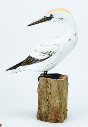Archipelago Gannet Preening Wood Carving D316, perched on a wood block, hand painted and carved. Fairtrade
