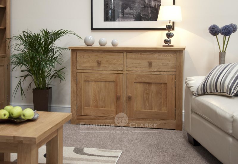 solid oak wide two door two drawer sideboard with full shelf in cupboard, chrome tapered knobs