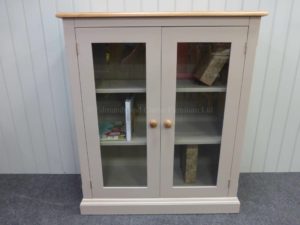Edmunds Painted Fully Glazed Bookcases. Image showing painted all over with oak top and oak handles, many colour and handle options available. mouled plinth and cornice