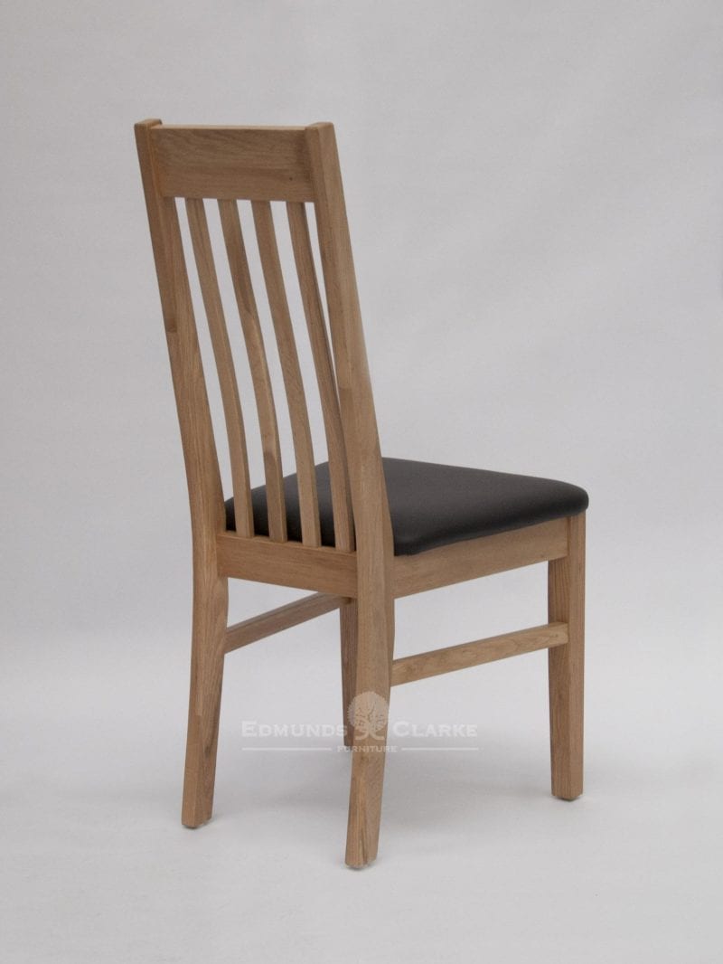 Sophia oak dining chair. slatted back with small lumbar support and faux leather seat pad for extra comfort