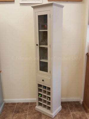 Edmunds Painted Tall Narrow Glazed Cupboard. image showing dunwich stone and premium pattern knob in pewter. wine rack under that holds 15 bottles
