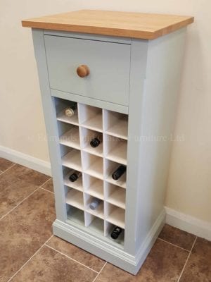 Painted 18 Bottle Wine Rack, main image showing white contrasting wine holders, lacquered oak top and drawer with matching oak knob.