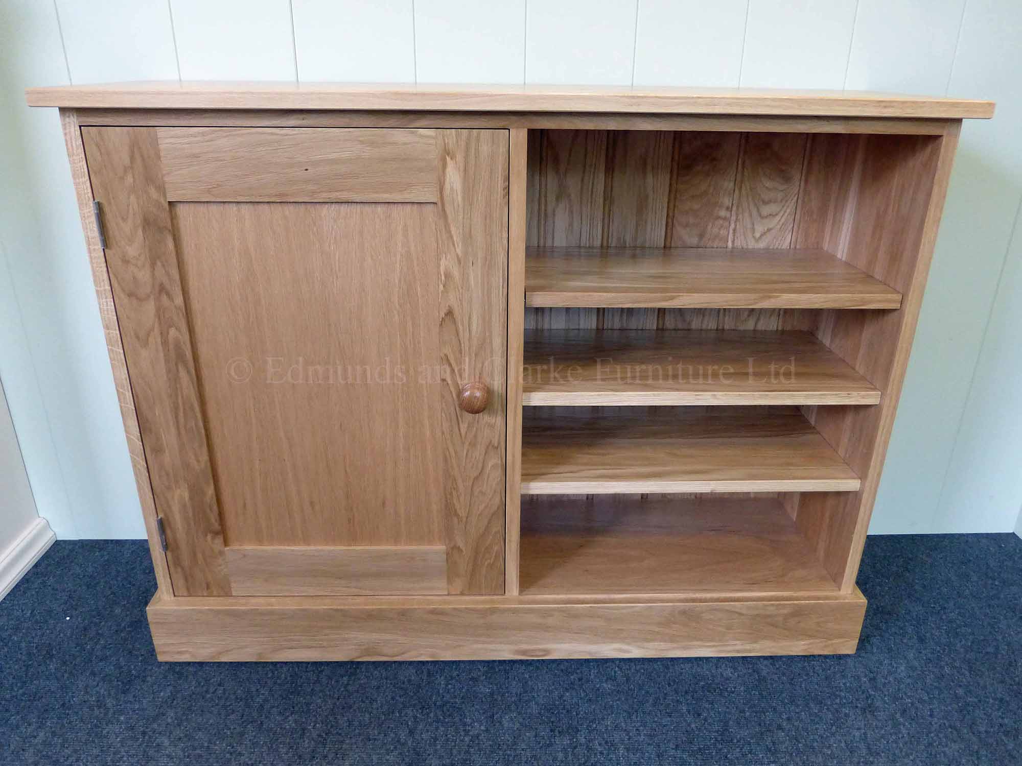 Solid oak multi cupboard paneled door on left with three adjustable shelves on right made all square edge in a shaker design