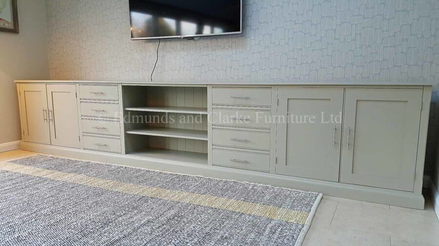 Long wide painted all over tv entertainment stand with eight drawers and four cupboard doors