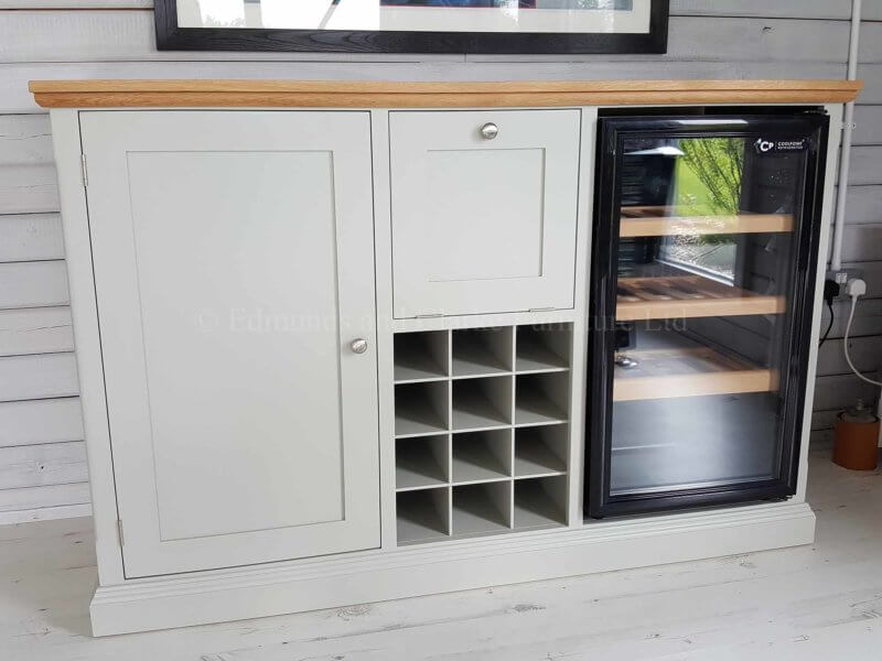 Edmunds painted drinks unit with wine rack that holds 12 bottles. a drop down flap for glasses. this particular cupboard has space for a wine cooler. 10 colours to choose from with solid oak top and choice of handles