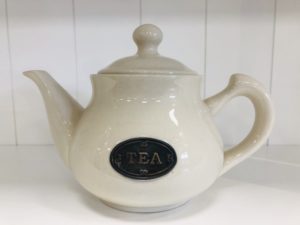 country kitchen ware - cream teapot with badge on front