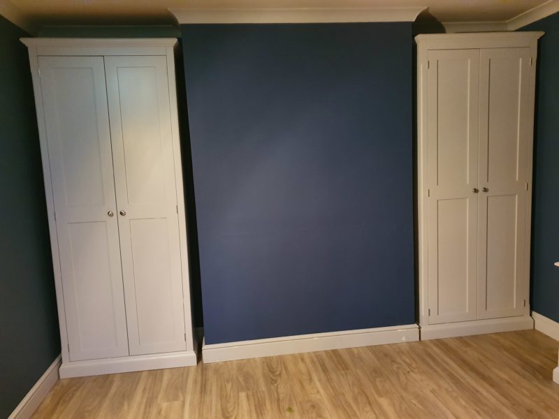 Pair of free standing two door cupboards, made to fit in an alcove