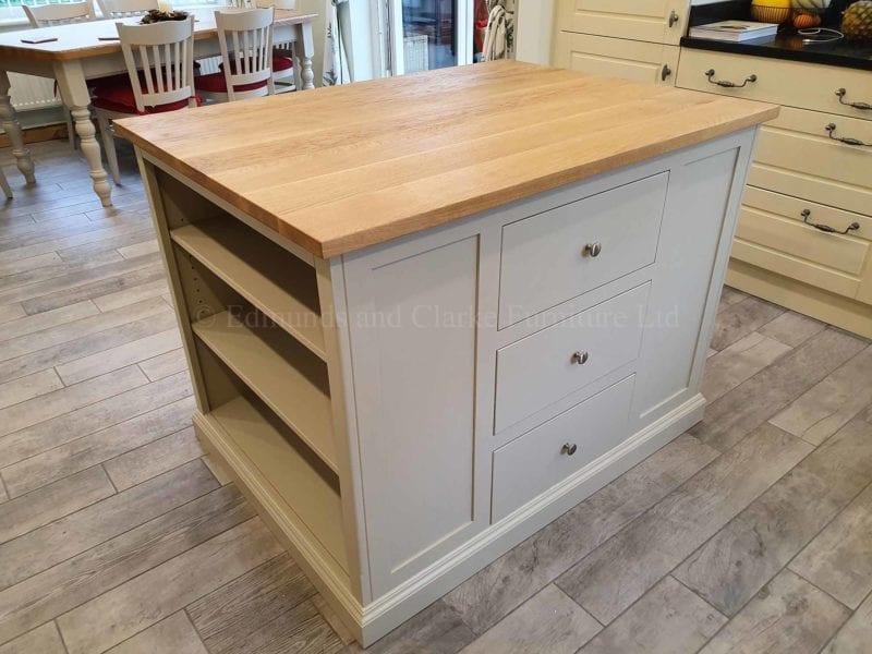 Kitchen Island painted grey with oak top, shelving both ends and central bank of drawers