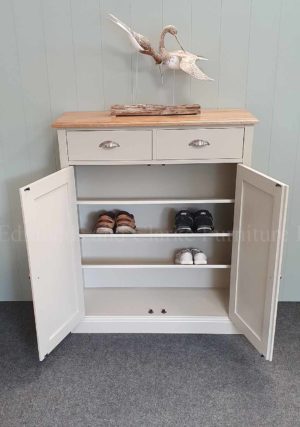 painted grey shoe cupboard with two doors and two drawers above, angled internal adjustable shelves