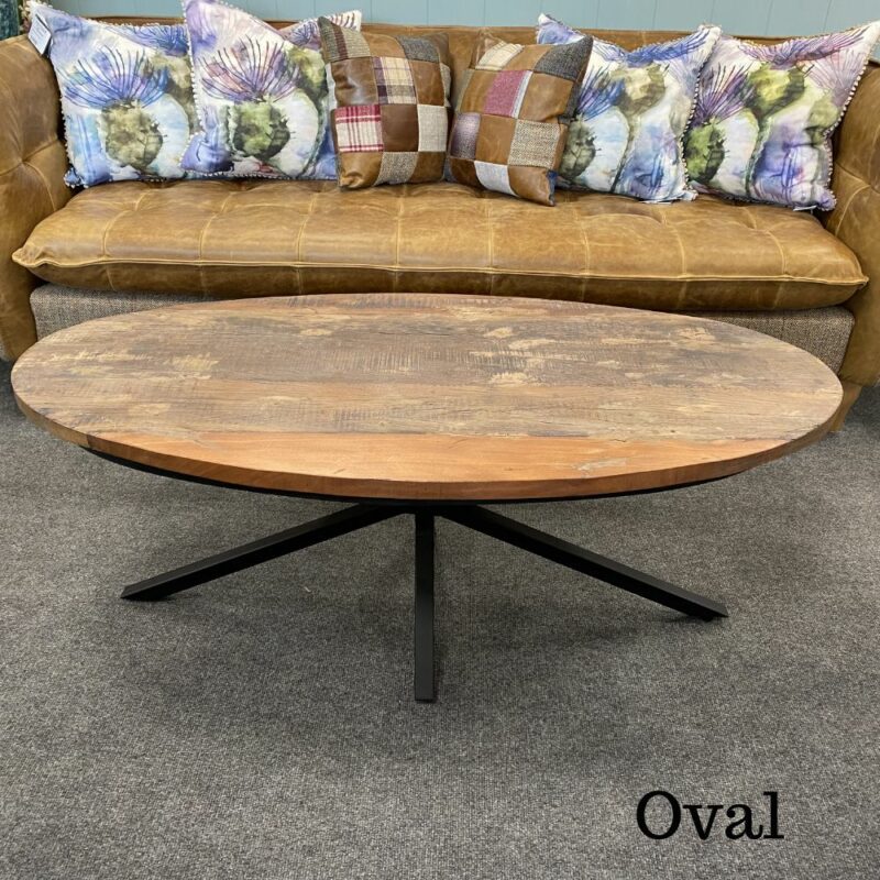 Java rustic coffee table oval round rustic top and metal legs. Edmunds & Clarke Furniture