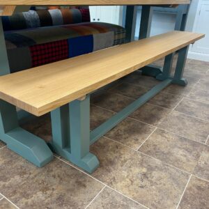 Edmunds "I" Frame bench shown with oak top and painted green smoke. Edmunds & Clarke Furniture
