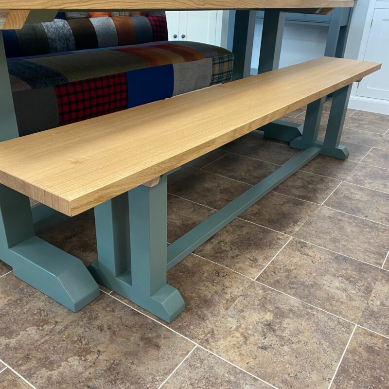 Edmunds I Frame bench shown with oak top and painted green smoke