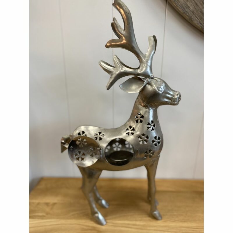 Small metal reindeer tea light holder showing opening for tea light. Edmunds & Clarke Furniture