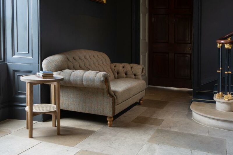 Howorth sofa room set showing sofa against black wall. Edmunds & Clarke Furniture
